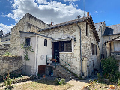 Maison ancienne avec jardin et garage en centre-ville